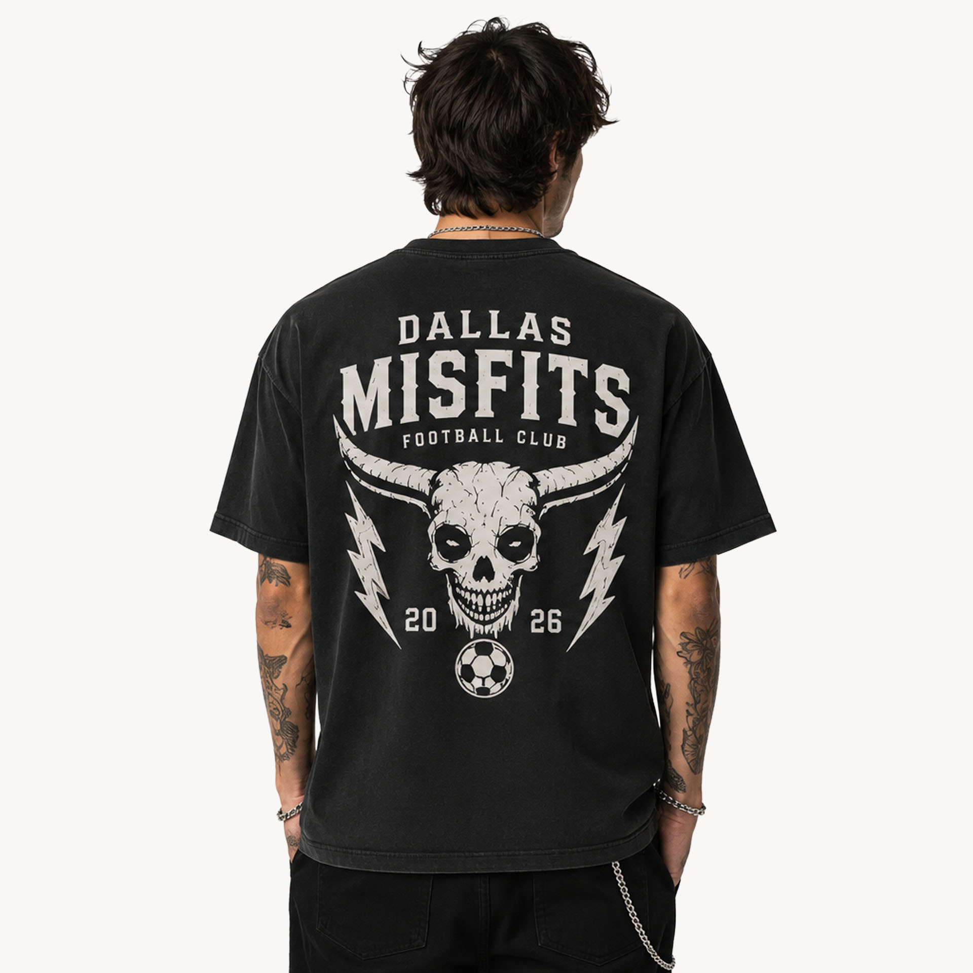Back view of a person wearing a black denim-style shirt with a large white skull design and 'DALLAS MISFITS' text on the back.